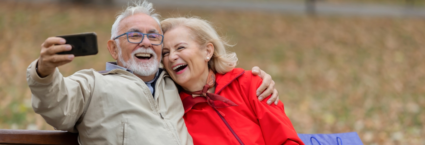 Retired couple on park bench