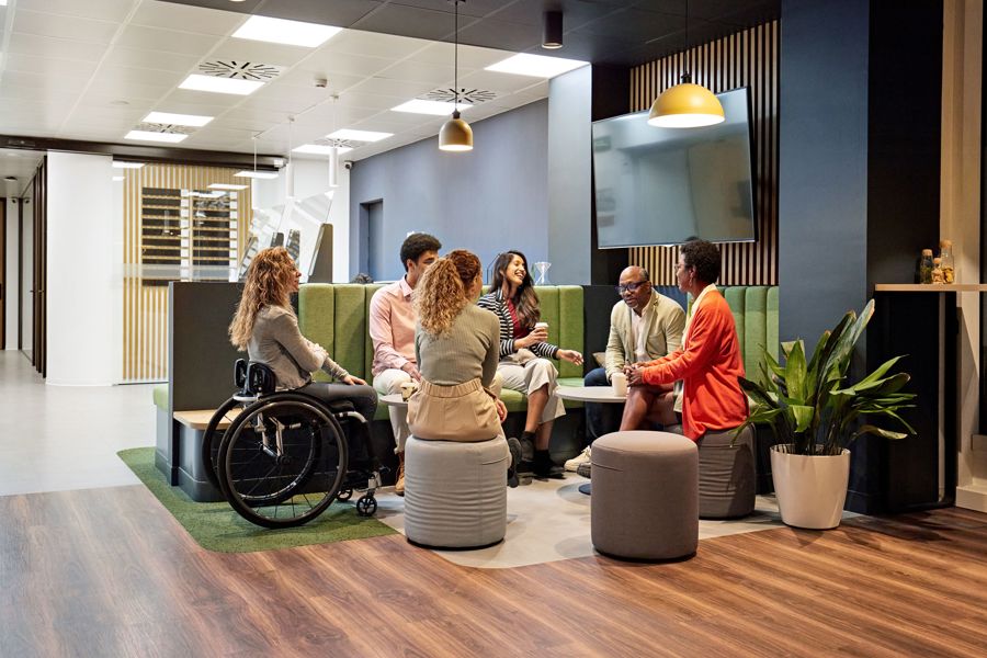 Diverse group of people sitting in a break out area